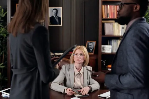 Immigration lawyer meeting clients in her Calgary office
